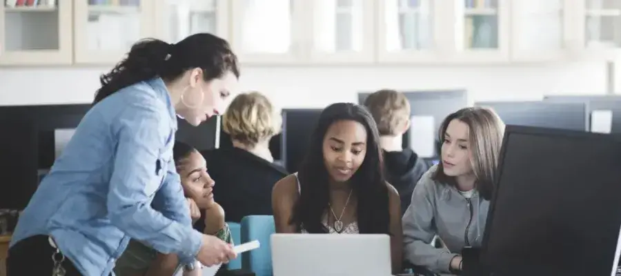 Students around a computer screen